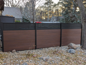Modern composite privacy fence with dark brown panels installed by Solid Fence Co. in Sioux Falls, SD.