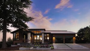 Modern dark garage doors installed on a contemporary home at dusk by Overhead Door Company of Salem in Salem, OR.