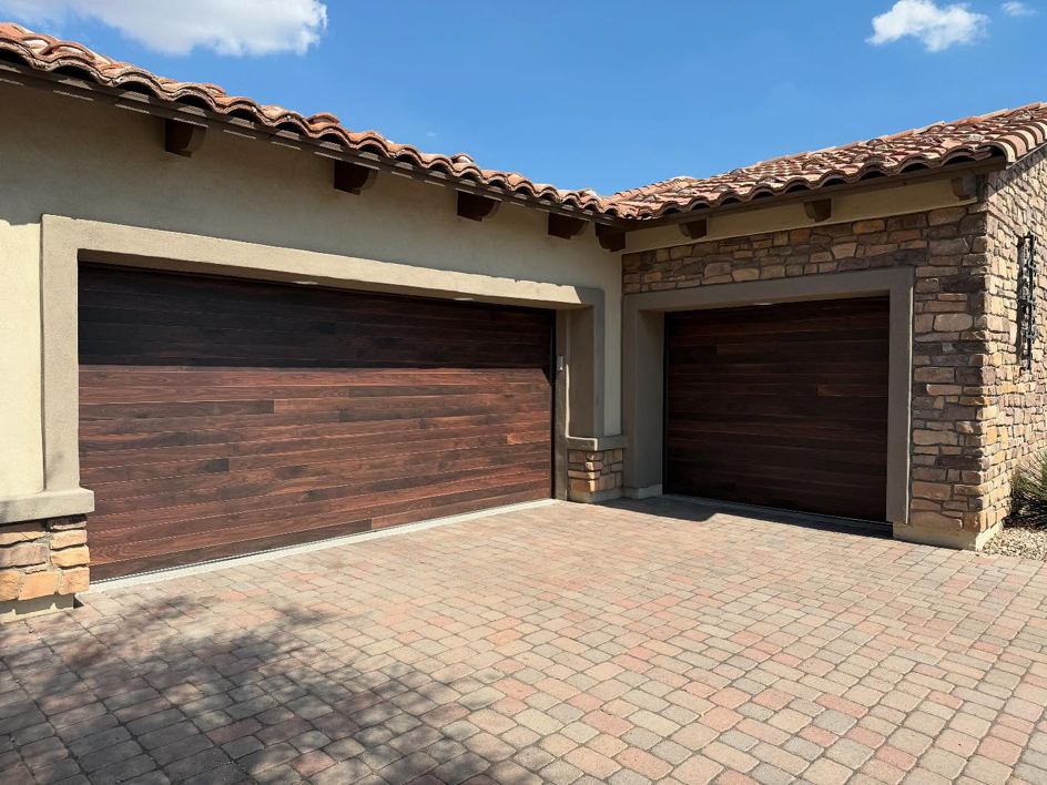 Modern dark wood residential garage doors installed by Mr. Garage Door in Bell Gardens, CA.