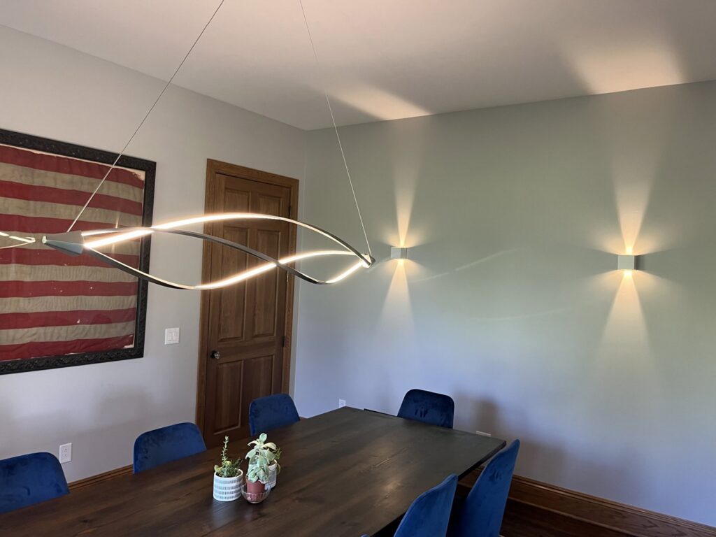 Modern dining room light fixtures installed by Ardent Electric, enhancing a home in Erie, PA.