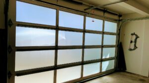 An interior view of a newly installed modern frosted glass garage door by CHS Garage Repair of Seattle, WA.