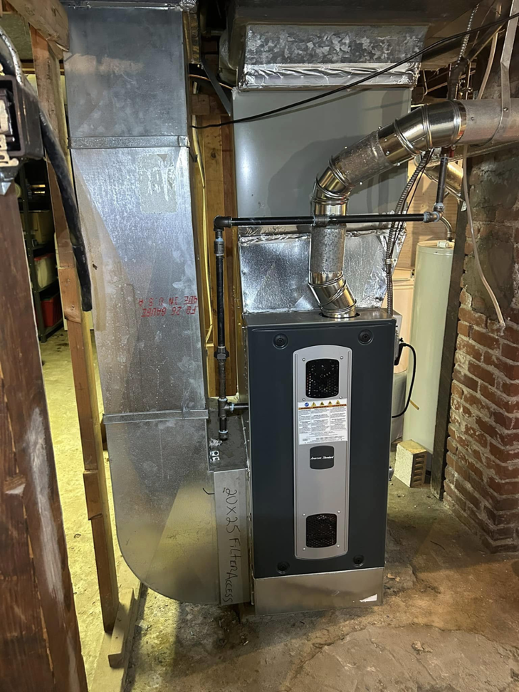 A modern furnace and ductwork system installed by Handy Properties LLC in Akron, OH.