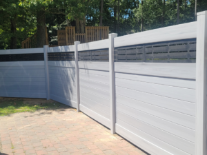 Close-up of a modern grey horizontal slat fence with black accents installed by AllMasterfence in Toms River, NJ.