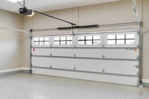 A sleek modern grey sectional garage door on a contemporary building, installed by Your Other Front Door LLC in Lakewood, CO.