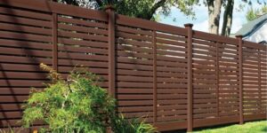 A modern dark brown horizontal slat fence installed by Austintown Fence in Youngstown, OH.