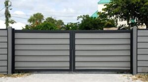 A modern horizontal slat gate, representing gate installation services by Overhead Door Company of Maricopa & Pinal County in Mesa, AZ.