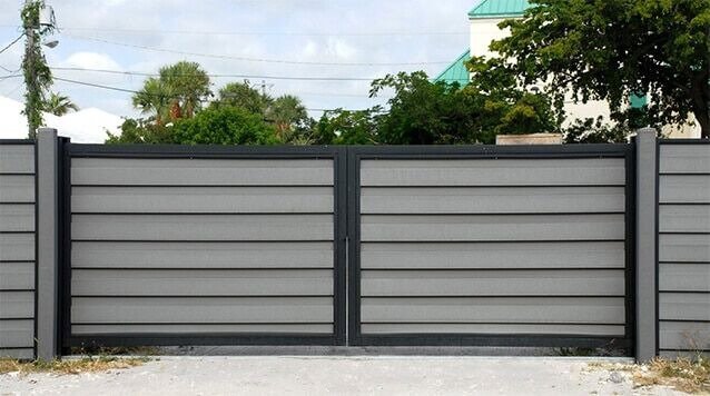 A modern horizontal slat gate, representing gate installation services by Overhead Door Company of Maricopa & Pinal County in Mesa, AZ.