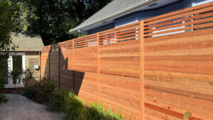 A modern horizontal slat wood fence installed by Jaz Builders Inc for privacy in Santa Clara, CA.