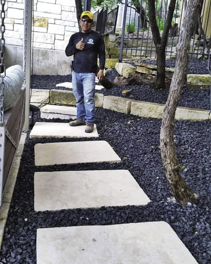 A modern horizontal slat wooden fence installed by Waldemar Landscape & Design in Austin, TX