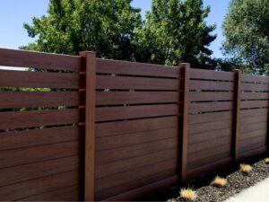 A modern horizontal wood-look fence providing privacy, installed by Ace Fence Company in Fort Lauderdale, FL.