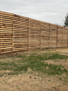 A newly installed modern horizontal wood fence by Escamilla Fence Co. in Knoxville, TN