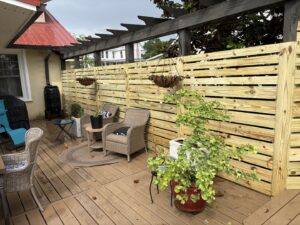 A modern horizontal wood privacy fence installed on a deck by CSRA Solutions in Jackson, SC.