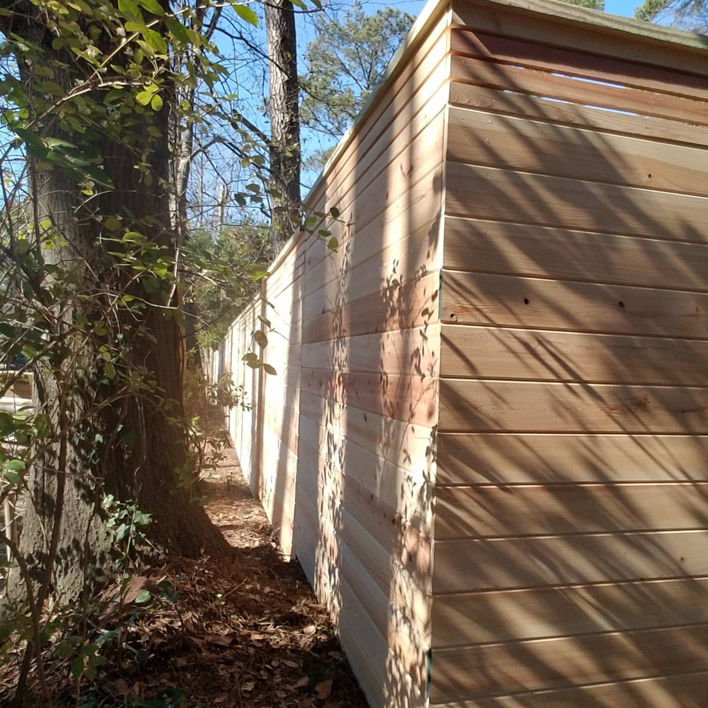 A modern horizontal wood privacy fence installed by Fence & Custom Gatework LLC in Columbia, SC