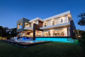 Modern house exterior with extensive outdoor and indoor lighting installed by Performance Electrical Contracting Inc. in Jacksonville, FL