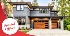 A modern house showcasing two stylish wooden garage doors with windows from Overhead Door Company of Central Missouri in Columbia, MO.