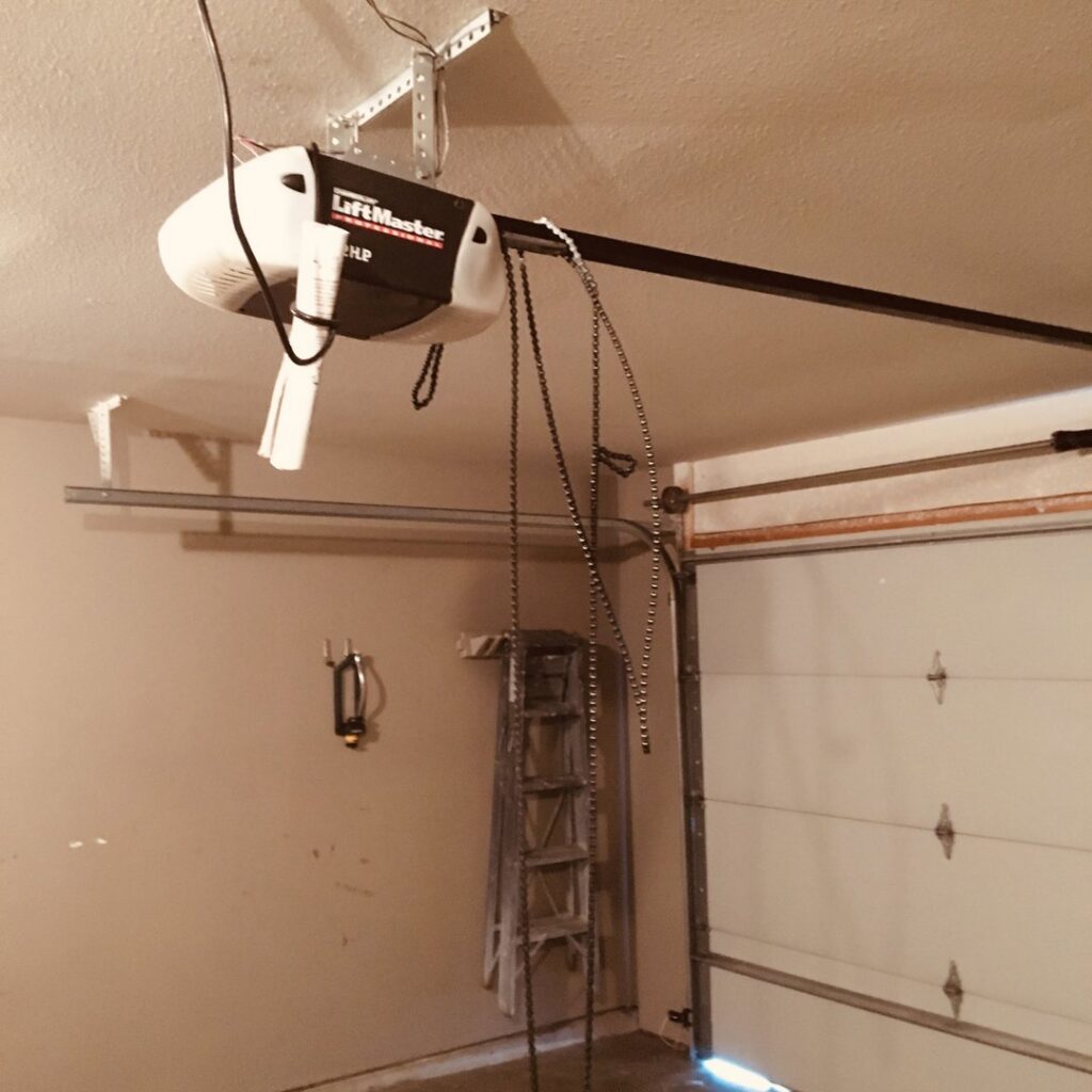 A modern house featuring a stylish white garage door, installed by Overhead Door Company of Central Missouri in Columbia, MO.