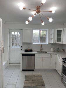 A modern kitchen featuring a unique ceiling light fixture installed by Moss Contracting in Philadelphia, PA.