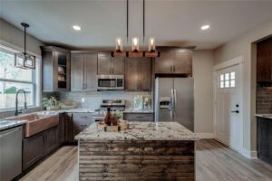 A modern kitchen showcasing new pendant and recessed lighting installed by Electrifying Services in Indianapolis, IN