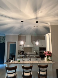 Modern kitchen with new pendant and recessed lighting installed by 3E Enterprises, LLC in Washburn, MO.