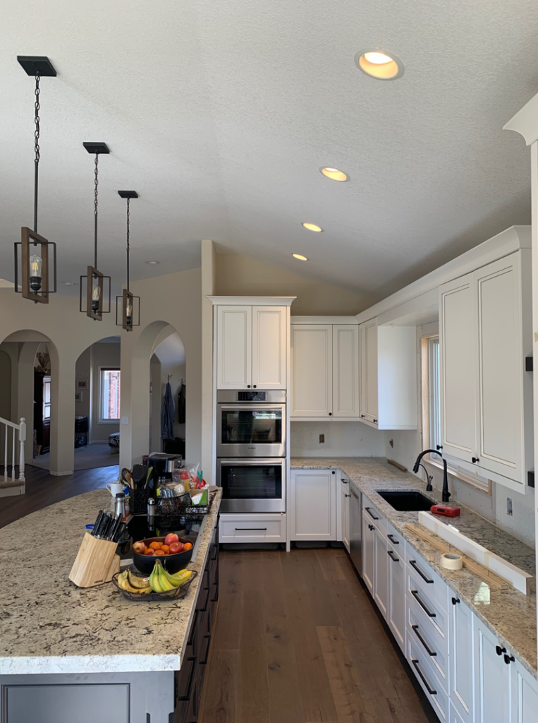 Modern kitchen with new recessed and pendant lighting installed by Grason Electric in Fort Collins, CO.