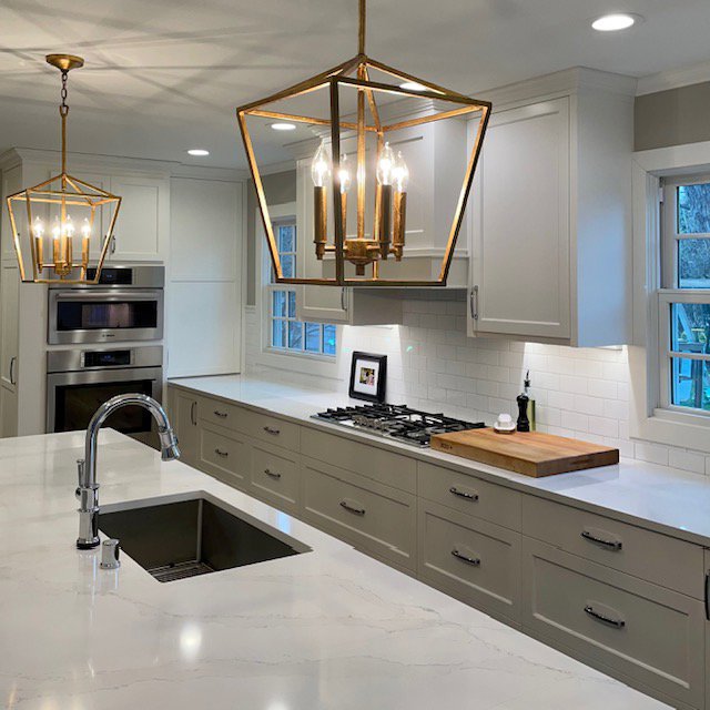 Modern kitchen with new pendant lights and recessed lighting installed by Kavanagh Electric in Fresno, CA.