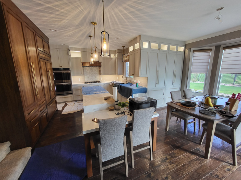 Modern kitchen lighting installation with pendant and recessed lights by Sabo Electric in Rapid City, SD.
