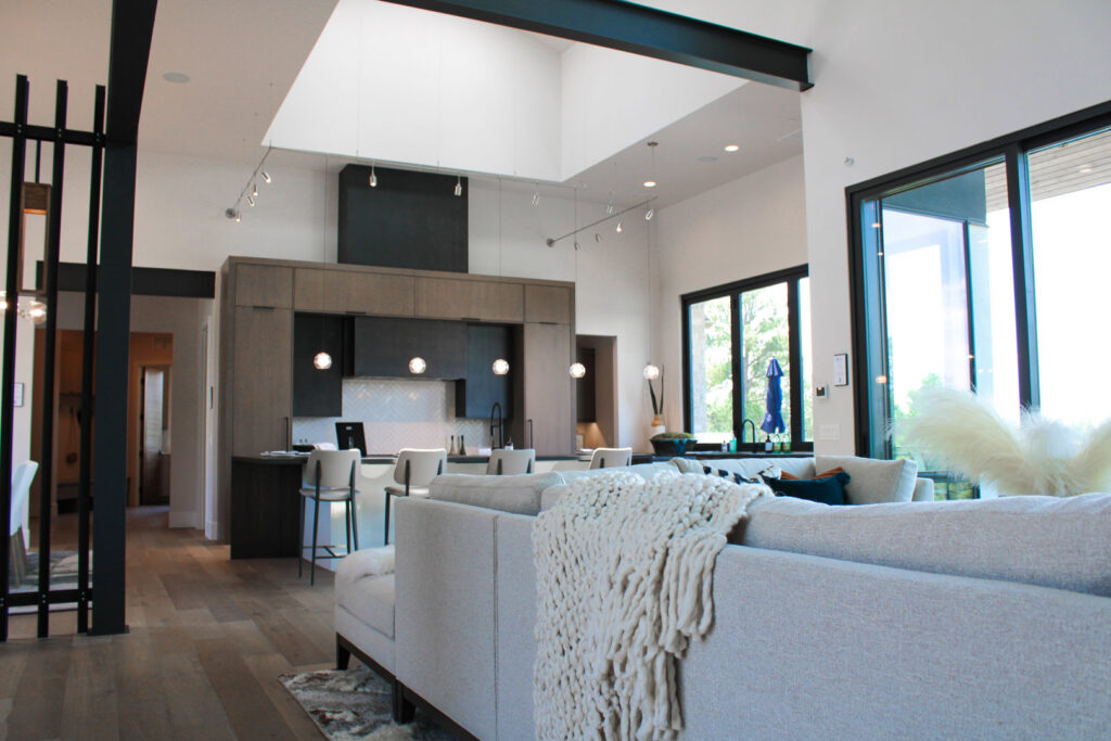 Contemporary kitchen and living room with various lighting fixtures installed by ACJ Electric LLC in North Babylon, NY.