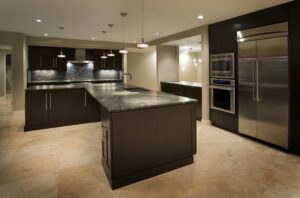 A modern kitchen showcasing sleek pendant and recessed lighting installed by Castle Electrical & Lighting in Scottsdale, AZ.