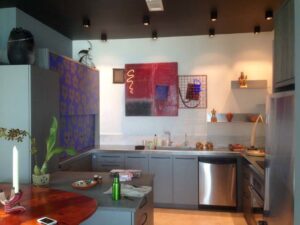 A modern kitchen featuring recessed and track lighting installed by Christensen Electric in Galveston, TX.