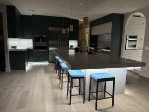 Modern kitchen featuring under-cabinet and pendant lighting installed by Sparks By Rabbit LLC in Scottsdale, AZ.