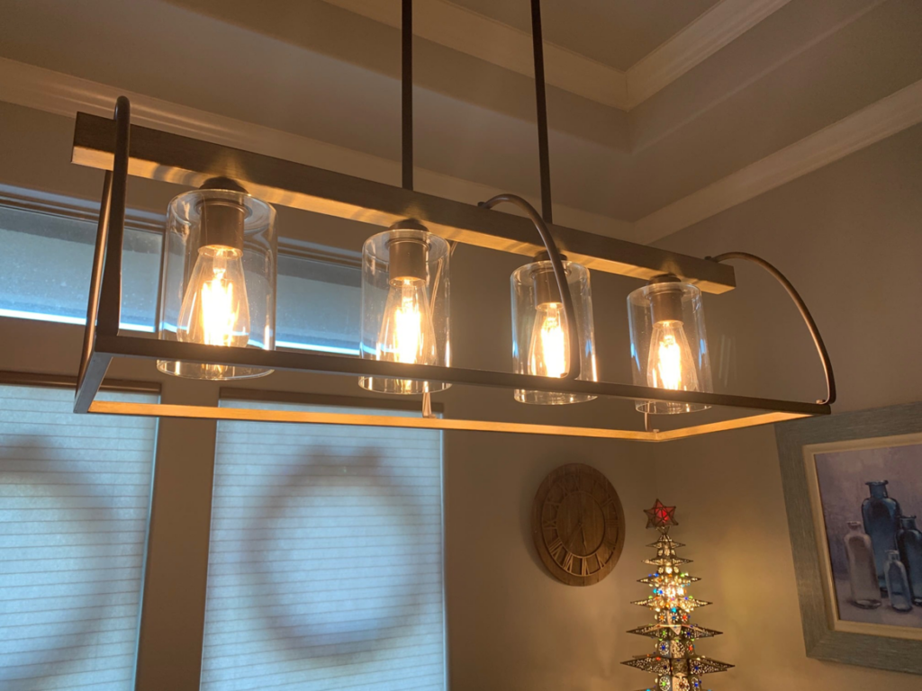 A modern linear light fixture with exposed filament bulbs installed by Chuck's Electric and Construction in Corpus Christi, TX