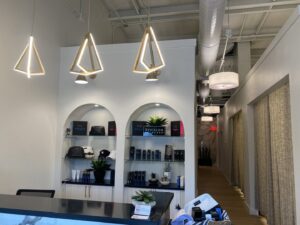 Modern pendant and recessed lighting installed in a reception area by Ultralight Electric in Houston, TX.