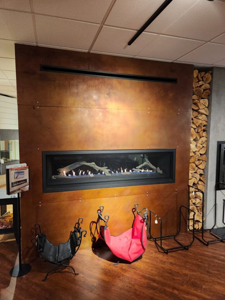 A modern linear gas fireplace installed in a wall, showcasing services by Wood Stoves For Sale in Fairbanks, AK.