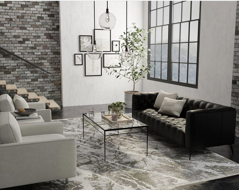 A modern living room featuring a large patterned area rug from Accents Galleria in Kansas City, MO