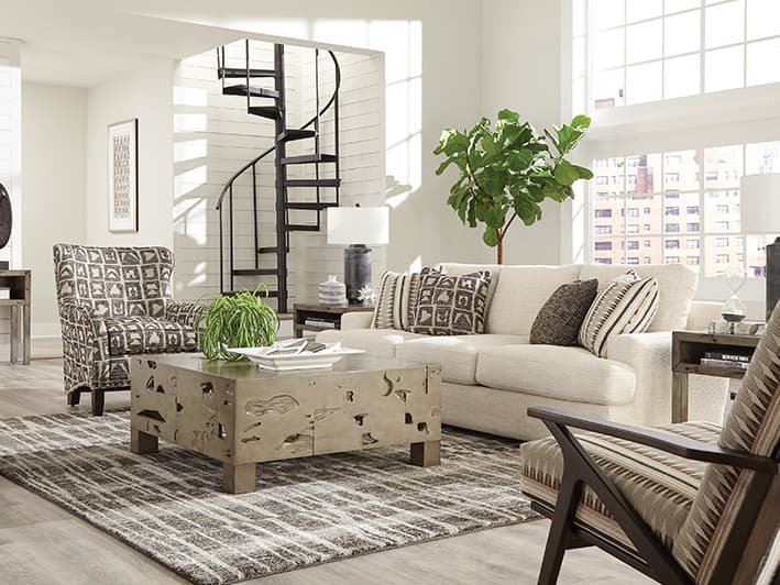A modern living room featuring a stylish area rug, installed by Odino Designs, llc in Portland, OR.
