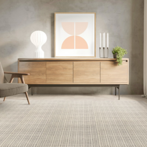 A modern living room featuring a light-colored striped carpet installed by Carpet World Fargo, ND