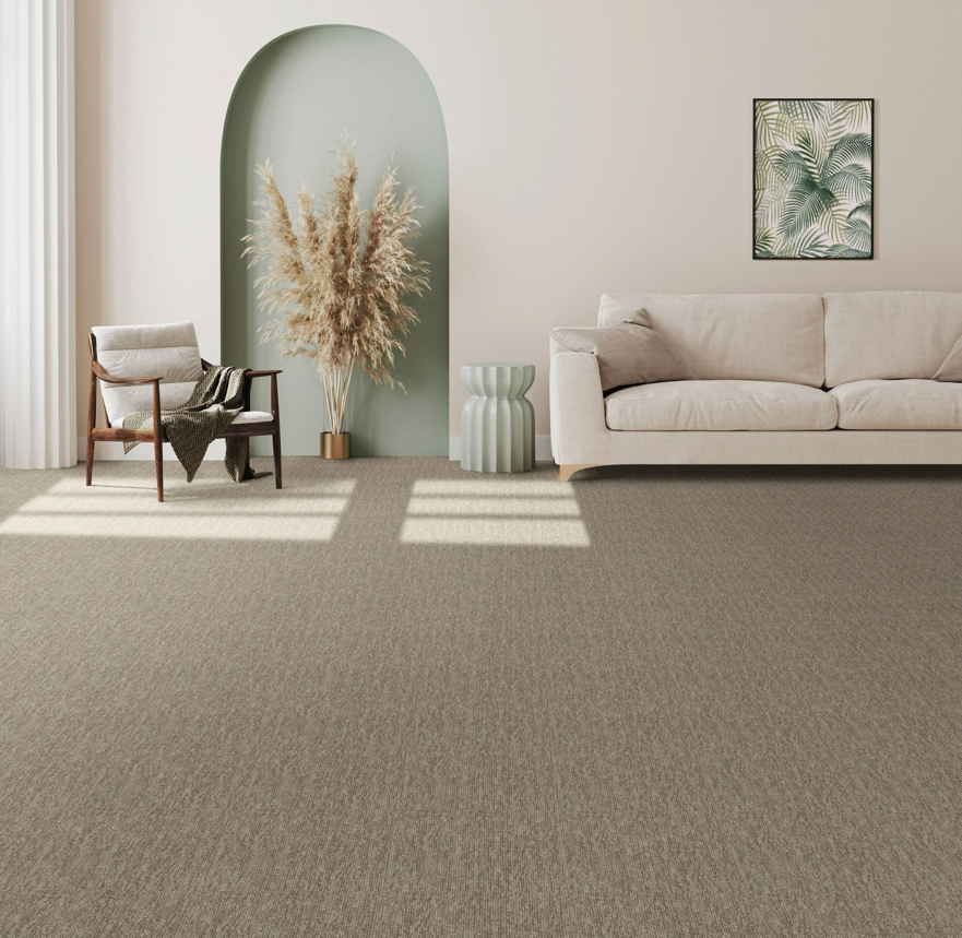 A modern living room showcasing a stylish patterned brown carpet installed by The Flooring Supplies Co. in Livonia, MI.