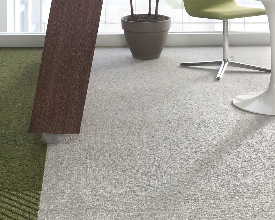 Modern office carpet installation featuring light grey and green carpet tiles by Capital Flooring in Orlando, FL.