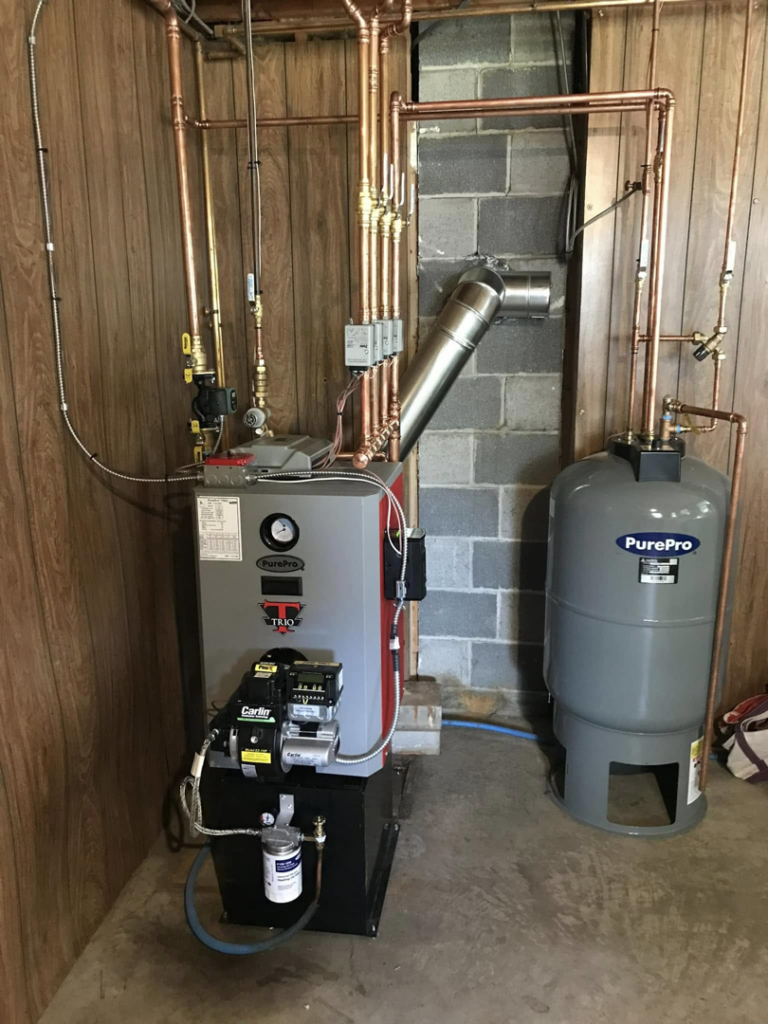 A modern oil boiler and expansion tank installation by Aaron Hamilton Heating in Brunswick, ME.