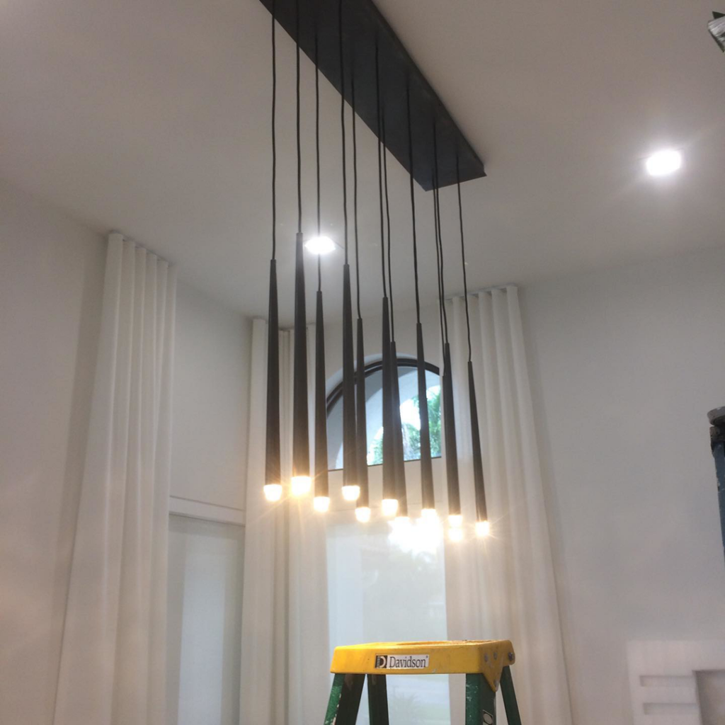 A modern multi-pendant light fixture professionally installed by Electriciansonway in Hollywood, FL