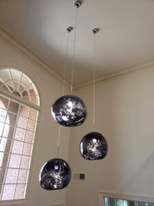Modern pendant light installation in a residential home by Superior Electric and Lighting LLC in Southaven, MS