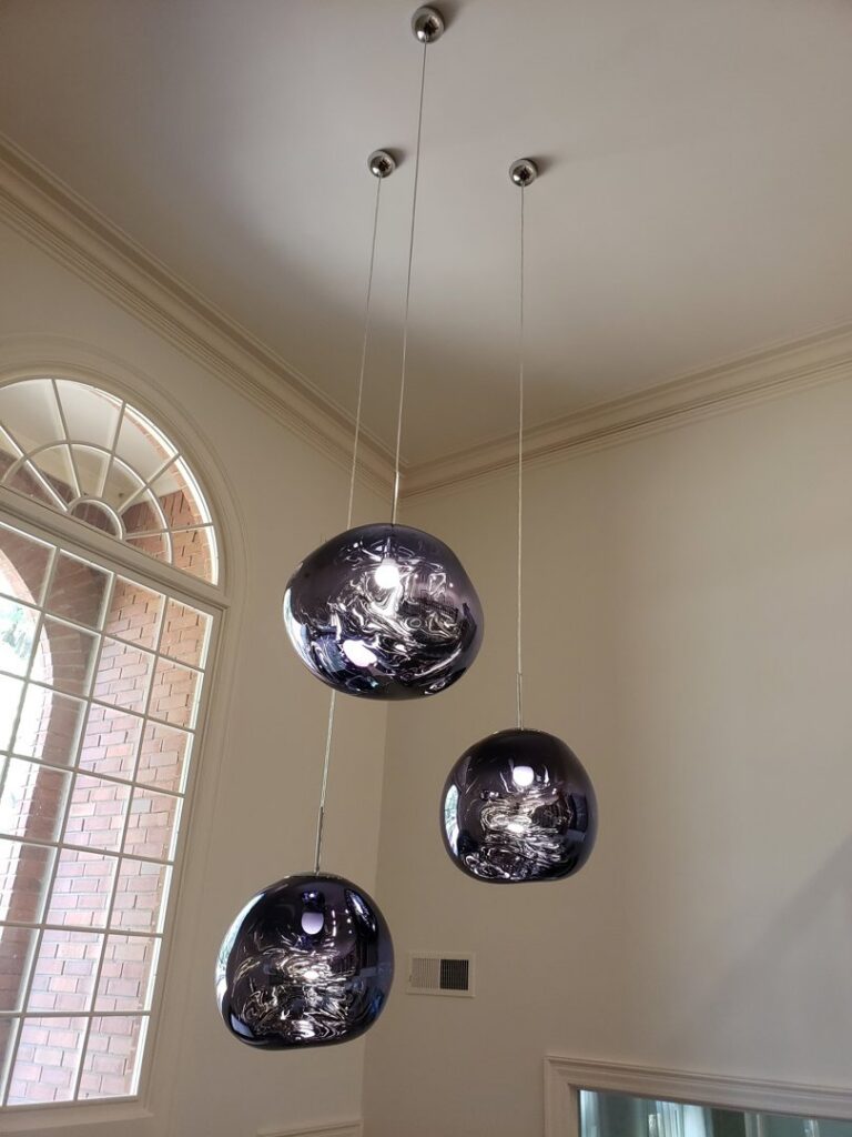 Modern pendant light installation in a residential home by Superior Electric and Lighting LLC in Southaven, MS