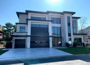 A modern residential garage door installed on a contemporary home by Coles Garage Door Service, LLC in West Columbia, SC.