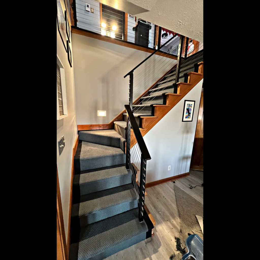 A modern staircase with newly installed grey carpet by Z Flooring in Noblesville, IN