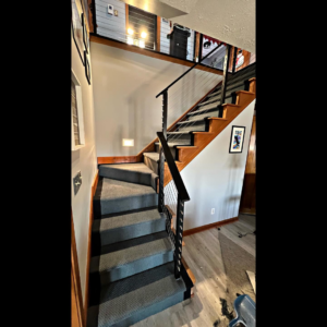 A modern staircase with newly installed grey carpet by Z Flooring in Noblesville, IN