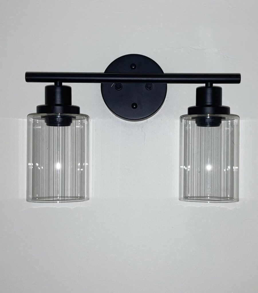 A modern black two-light vanity fixture installed by Goodie's Electrical Contractors LLC in Dothan, AL
