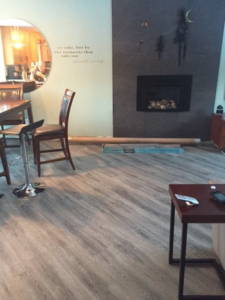 Modern vinyl plank flooring installation in a spacious living area by Alaska Flor-Wall, Inc. in Anchorage, AK.