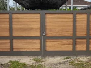 A modern wood and metal gate installed by HD Multi Service USA INC, showcasing quality craftsmanship in Miami, FL.