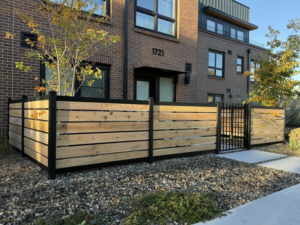 An angled view of a modern wood and metal privacy fence installed by ZBros Fencing LLC in Boise, ID.