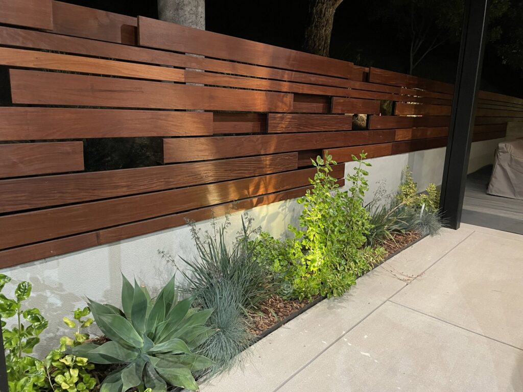 A modern wood slat fence complementing the landscaping, installed by Los Angeles Fence Builders in Los Angeles, CA.